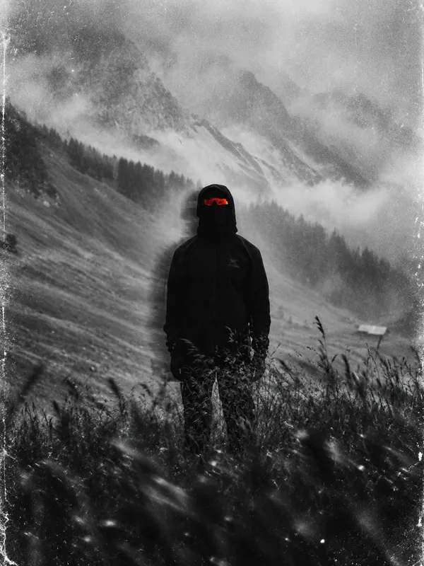 GORPED campaign image: a hooded figure in black layers and red mirrored sunglasses on a misty alpine slope